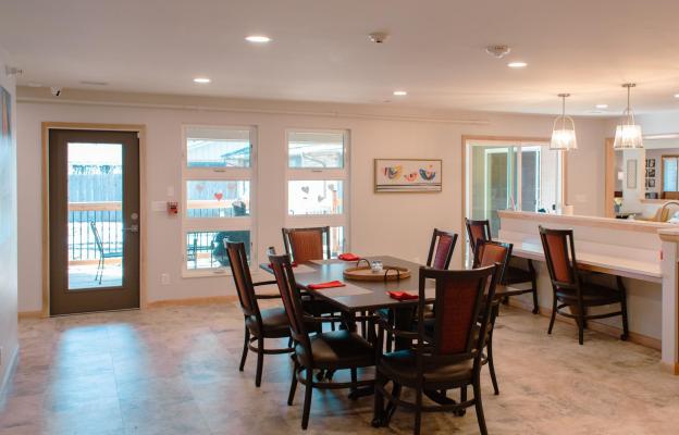 Large windows let in natural light and a view of the secure courtyard, where residents can enjoy the outdoors.