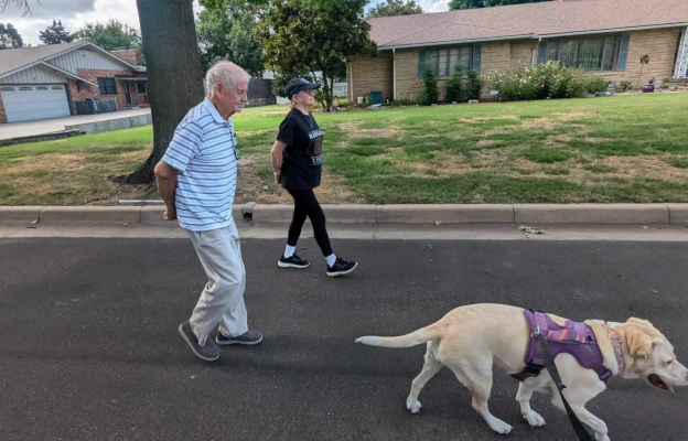 Residents enjoy walking with ComfortCare Homes' pets